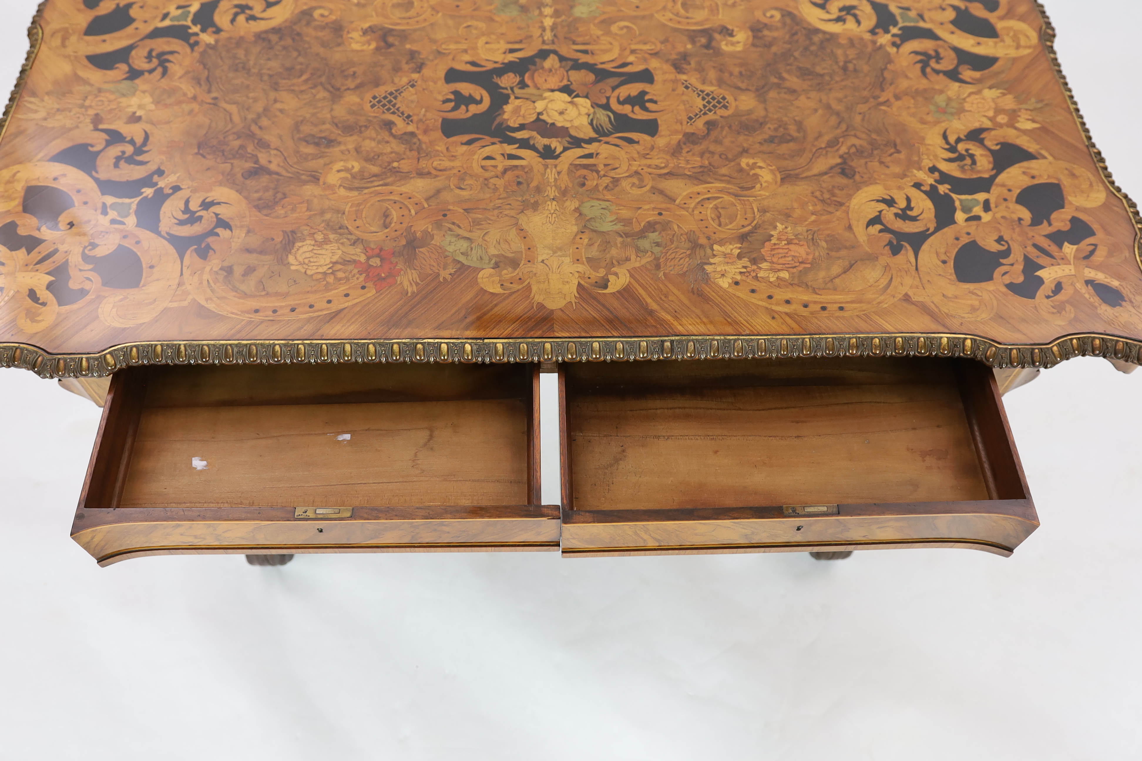 A good Victorian ormolu mounted walnut and marquetry centre table, 129cm wide, 70cm deep, 73cm high